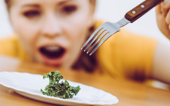 Shocked young woman being on diet