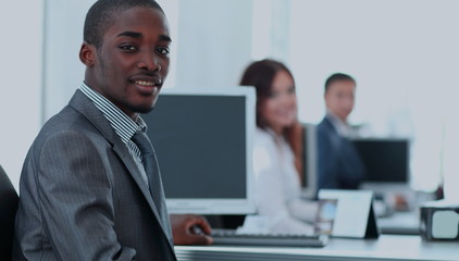 Portrait of happy afro-american  businessman with  colleagues wo