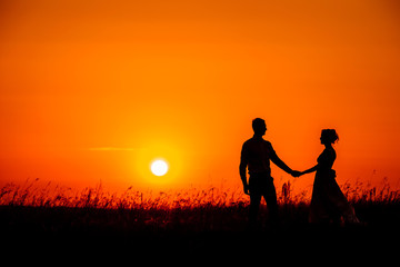 Fototapeta na wymiar wedding couple with the sunset