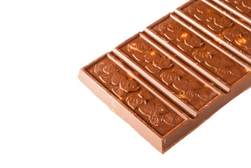 chocolate bar with nuts on a white surface