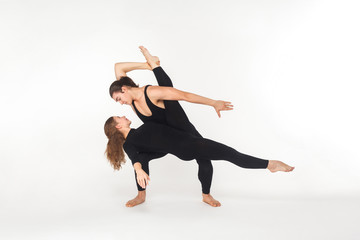 Two flexibility friends dancing, doing performance.