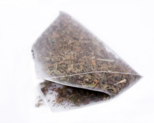Organic mint melange tea bag isolated on white background