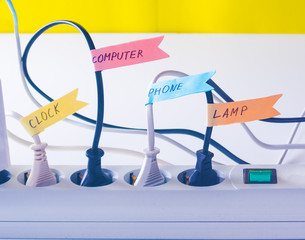 ?onvenient life hack with stickers on the wires inserted into the socket