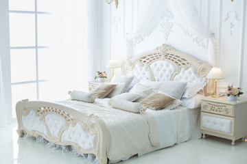 Morning in a beautiful light bedroom in the style of rococo.