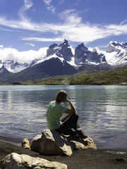 Woman on rock, Lago Pehoe, Torres del Paine National Park