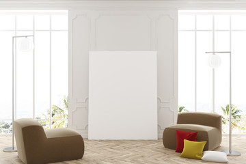 White living room, poster, and armchairs