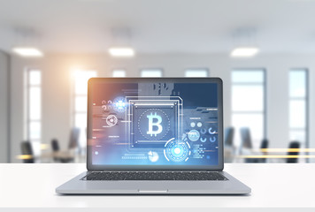 Fototapeta premium Laptop with a bitcoin symbol in office