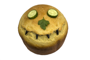 One round loaf of wheat bread. Isolated on white. A loaf of round bread with a crust in the shape of a smile. View from above. Top view.