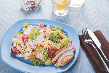 caesar salad pasta avocado chicken fillet tomato sauce close up