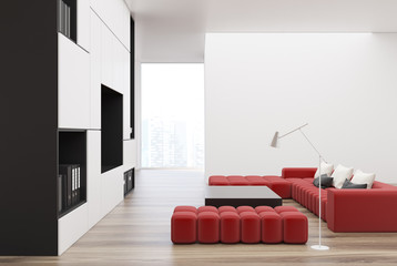 White and black living room, TV, red sofa
