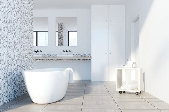Gray tile bathroom, white tub