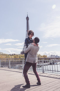 Multi-ethnic Couple Having Fun In Paris Near Eiffel Tower