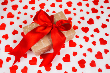 Valentine's Day. Presented as a red ribbon on a white paper with red hearts