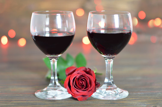 Valentines Day wine glasses and red rose. Romantic table setting