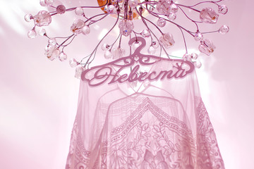 wedding dress hanging from a mirrored wardrobe