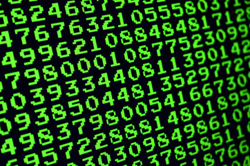 Macro of password selection on the monitor of the office computer. The concept of hacking the protection of a personal data keeper. The stream of supposed digital passwords of four and five digits