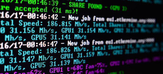 Macro snapshot of the program interface for crypto currency mining on the monitor of an office...