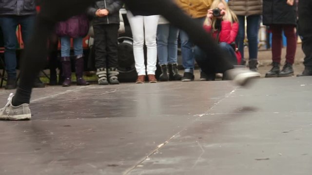 Crowd of people watching young guys dancing breakdance open air youth subculture