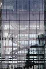 Fototapeta na wymiar Swirling staircase of a glass building