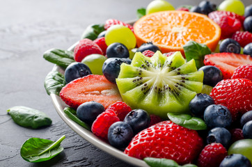 Fruit platter with various fresh strawberry, raspberry, blueberr