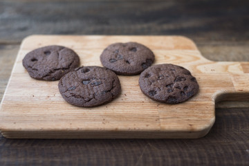 cookies on a wooden table.cookies stacked on a wooden board