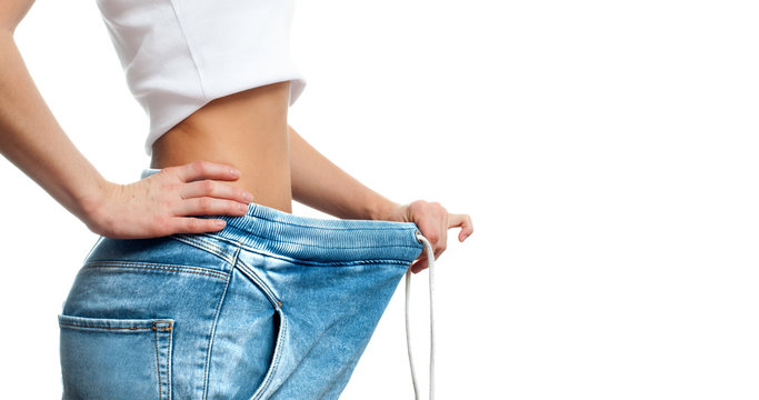 Woman is measuring waist after weight loss,. Diet concept