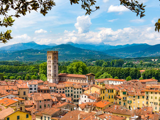 Lucca Italy landscape travel rooftops with mountains in background