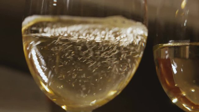White wine poured into glass