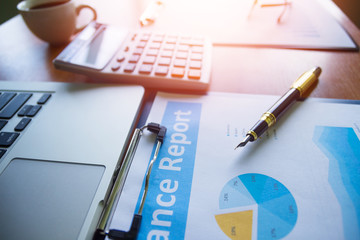 Pen,keyboard,calculator,report graph chart on office table,for Business.