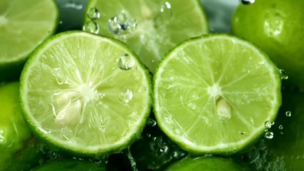 Limes Cut with Water Drops Slow Motion  - Powered by Adobe