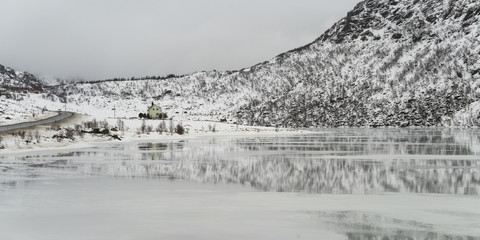 Reflection of mountain in sea, Lofoten, Nordland, Norway