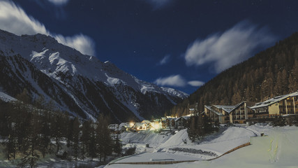 Beautiful night scenery of popular ski resort Solda (Sulden), candid vintage photography