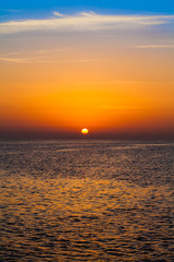 sunset over ocean. Sunset on the beach with beautiful sky. Dramatic sunset