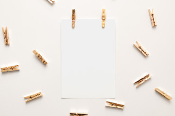 Blank Vertical Postcard and Gold Clothespin Mockup