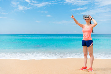 Fototapeta na wymiar beautiful fitness traveler standing on beach