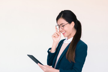 Young asian woman checking on her tablet