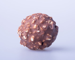 chocolate ball or chocolate bonbon on a background.