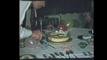 1953 50's dad slices birthday cake for family