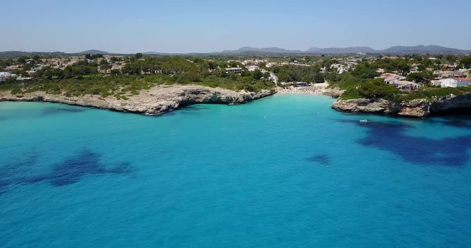 Drone aerial landscape of the beautiful bay of Cala Anguila with a wonderful turquoise sea, Porto Cristo, Majorca, Spain