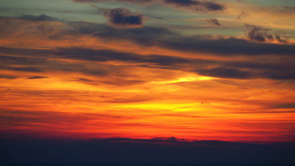Fototapeta na wymiar Fiery sunset from the old city of Bergamo to the Po valley. Lombardy, Italy