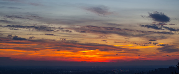 Obraz premium Fiery sunset from the old city of Bergamo to the Po valley. Lombardy, Italy