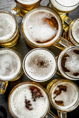 Glasses with beer. On black chalkboard.