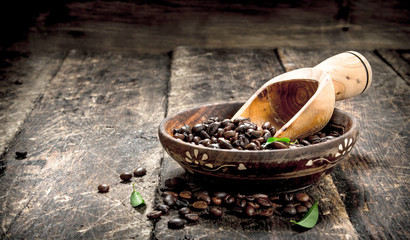 Coffee beans in a bowl.