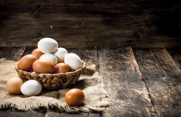 Fresh eggs in a basket.