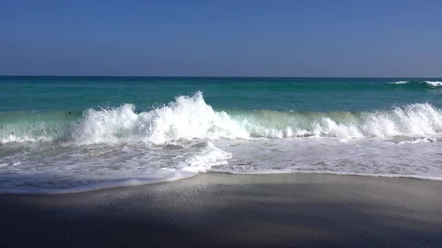 Ocean seascape scenic off Koh Samui, Thailand with wave crashing on sandy shore.