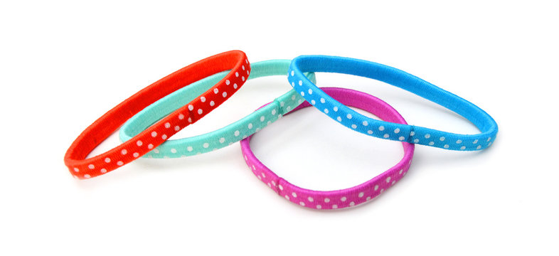 Colorful hair bands on white background 