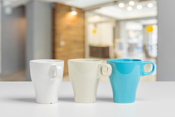 Tea or coffee mug on a table against blurred background