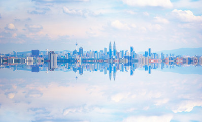 Kuala Lumpur city skyline with stunning reflection in water . - obrazy, fototapety, plakaty