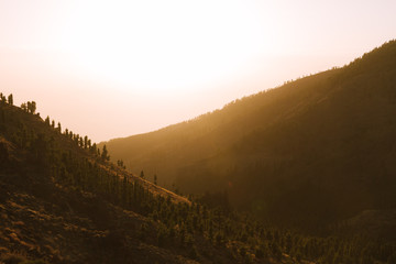 Colorful sunset in valley in mountain landscape