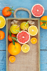 Different fruits and glass with fresh orange juice
